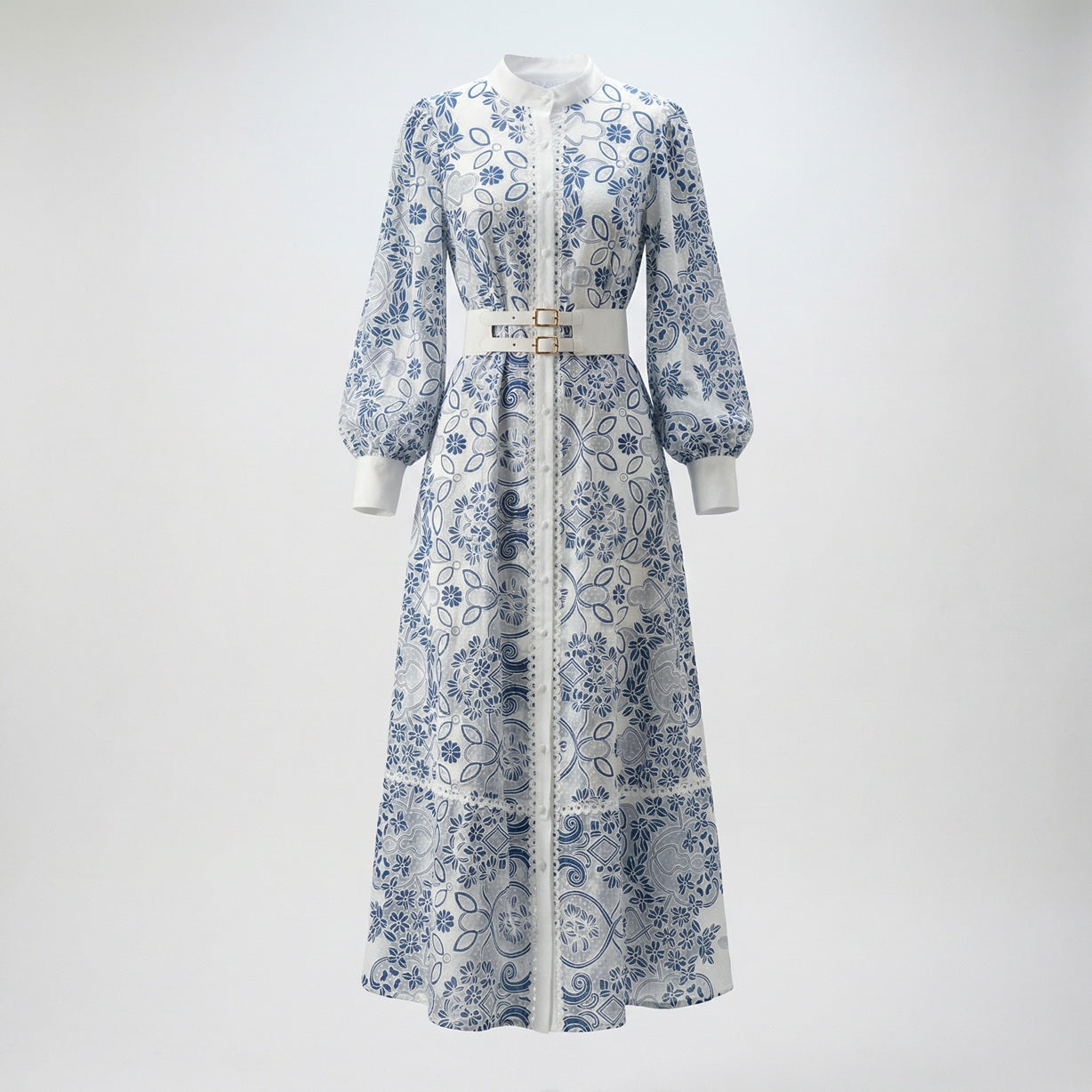 Mary maxi dress featuring blue floral lace, lantern sleeves, and a white double-buckle belt