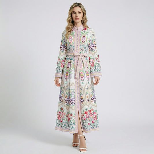 Front view of the Melissa maxi dress in white with vibrant pink and yellow floral patterns, featuring a mandarin collar and bell sleeves.