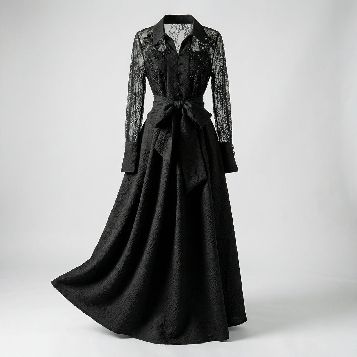 Full-length view of Monika 140cm maxi dress featuring sheer lace sleeves and textured wood-grain jacquard fabric in black and cream.