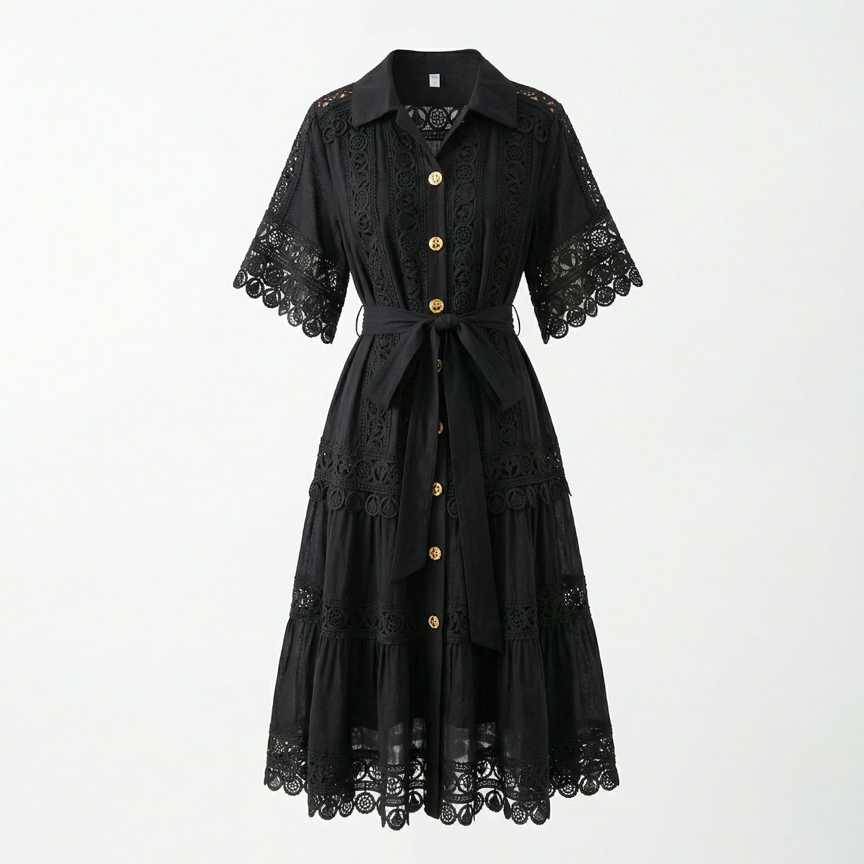 The Noora midi dress shown in black, white, sage green, and camel featuring intricate lace panels, gold buttons, and a matching belt.