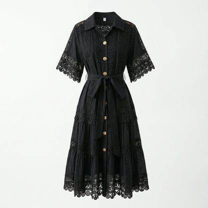 The Noora midi dress shown in black, white, sage green, and camel featuring intricate lace panels, gold buttons, and a matching belt.