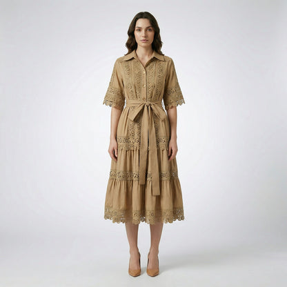 The Noora midi dress shown in black, white, sage green, and camel featuring intricate lace panels, gold buttons, and a matching belt.