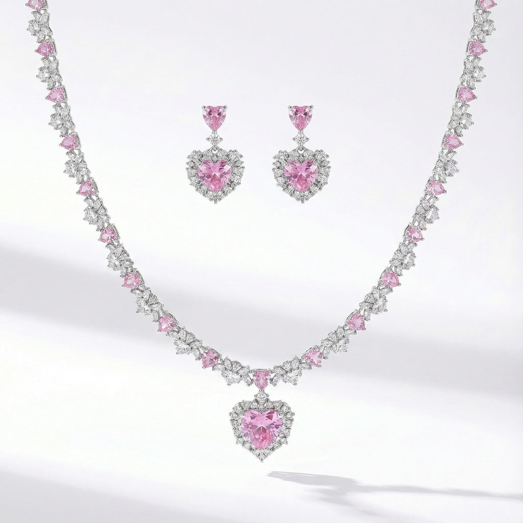 Silver jewelry set with pink heart shaped cubic zirconia necklace and matching earrings