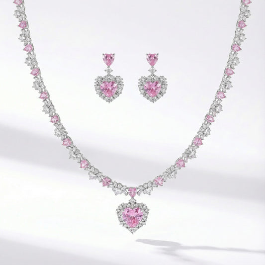 Silver jewelry set with pink heart shaped cubic zirconia necklace and matching earrings