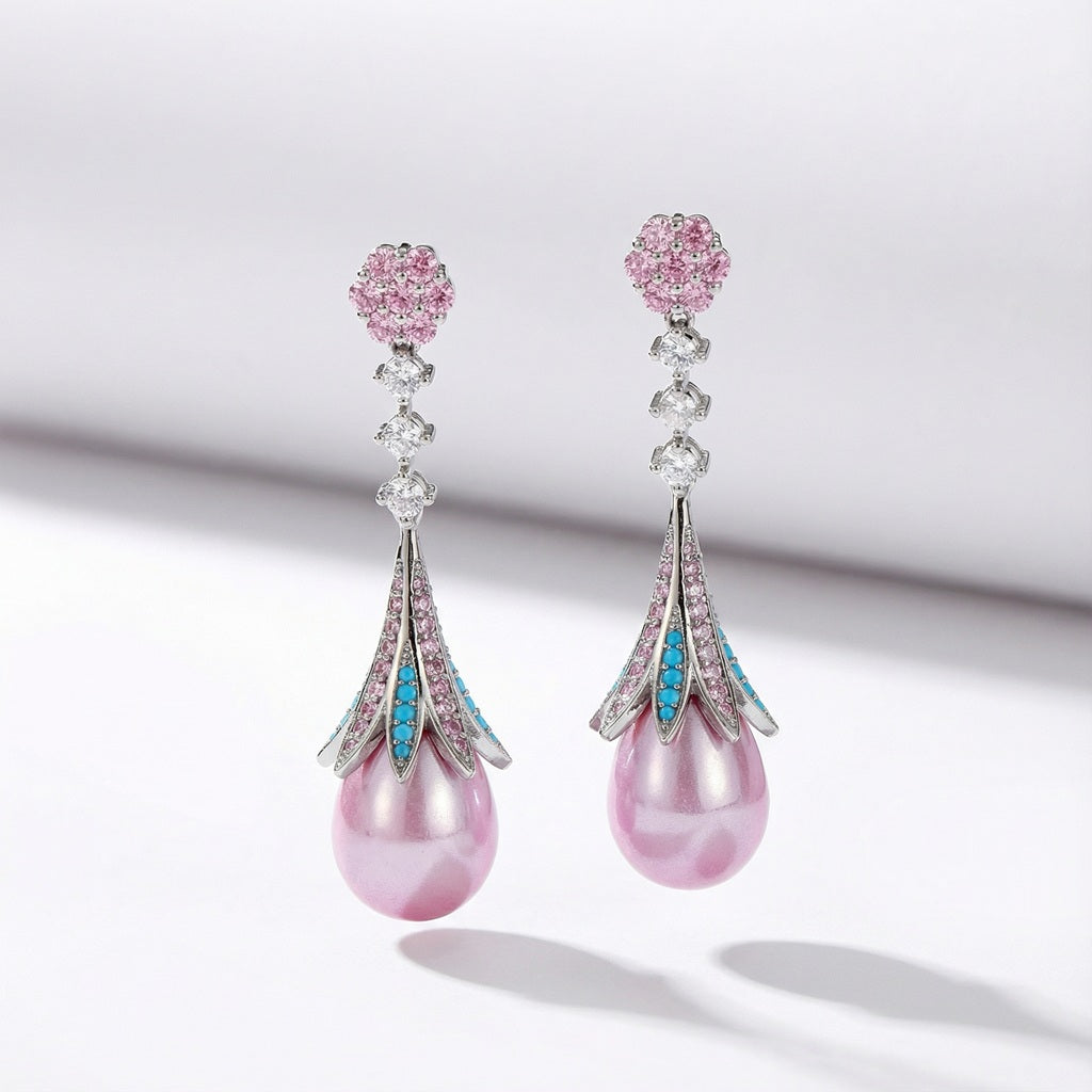 Pink teardrop earrings with large pearl, pink and blue cubic zirconia, and floral stud for elegant feminine look