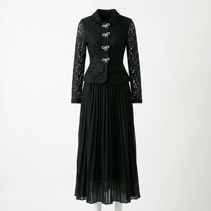 Rachel two-piece set featuring a long-sleeve black lace peplum top with rhinestone bows and a matching black pleated maxi skirt.