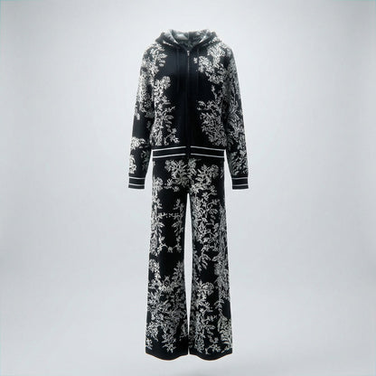 Rafaella two-piece knit tracksuit featuring a black floral jacquard pattern on a grey, cream, black, and beige background.