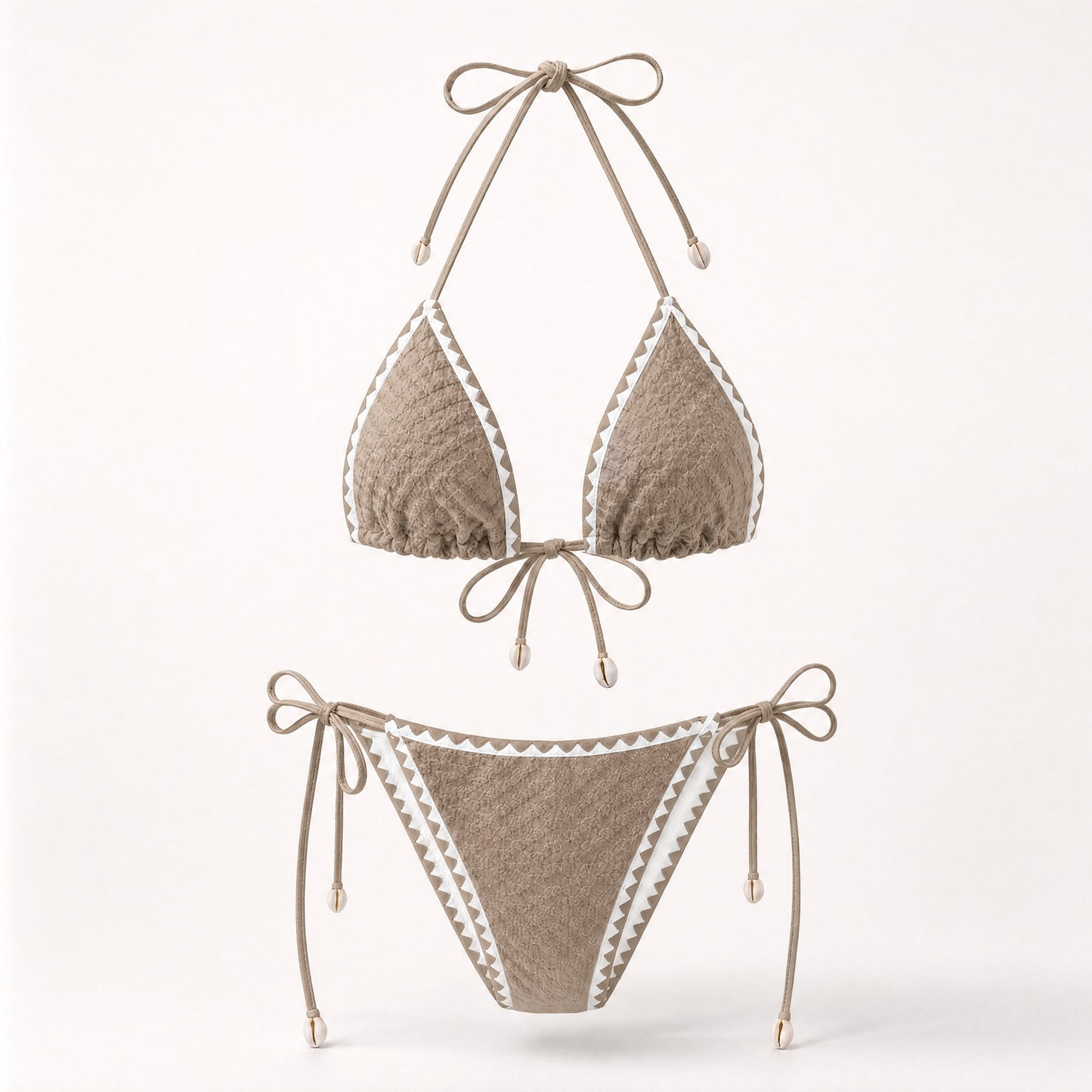 Earthy mocha tan boho bikini with shell details and white trim.