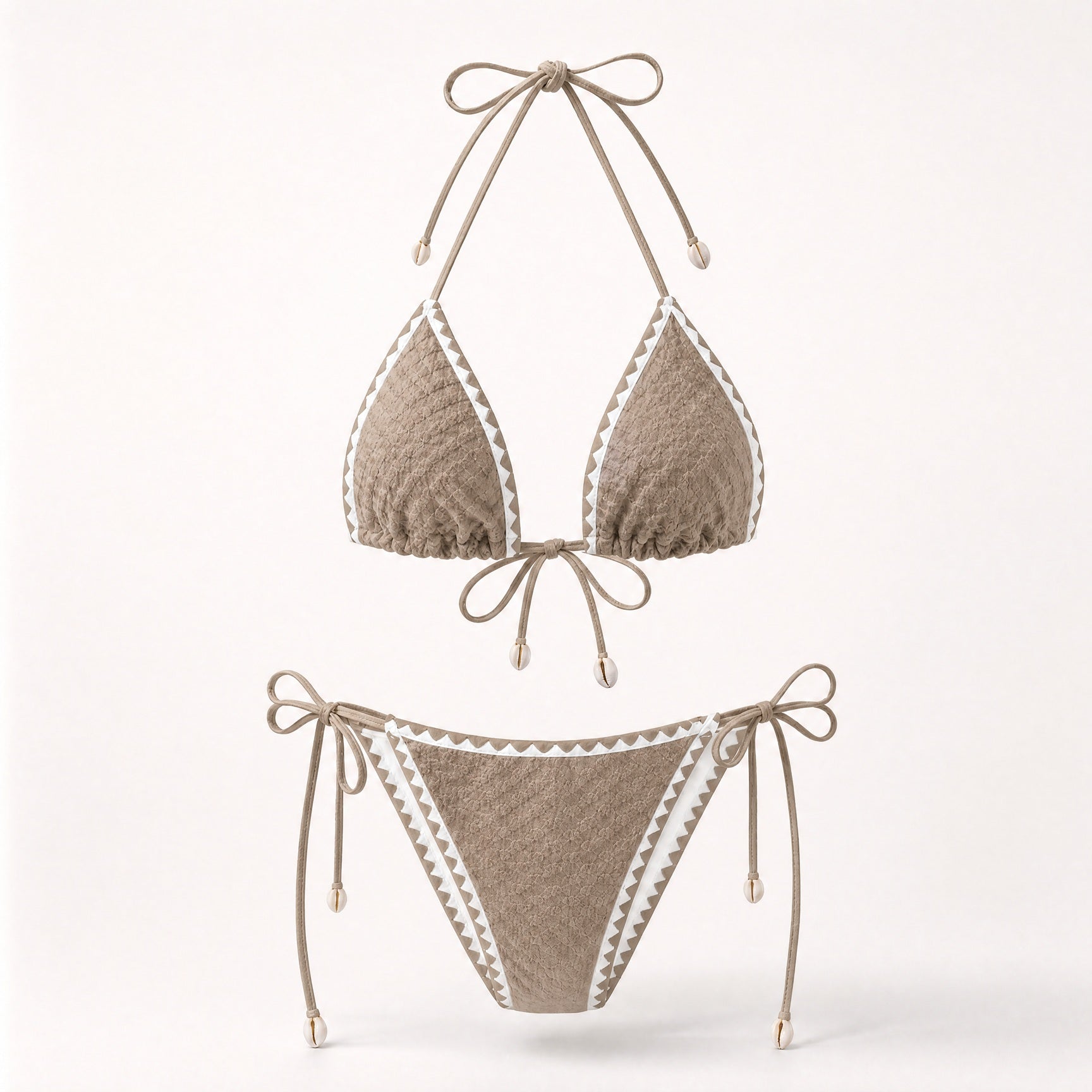 Earthy mocha tan boho bikini with shell details and white trim.