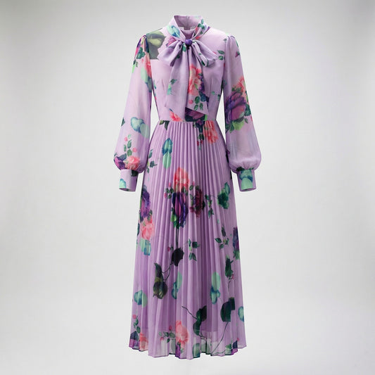 Full-length view of the Sonia lavender floral pleated maxi dress with pussy-bow neckline and long sheer sleeves.