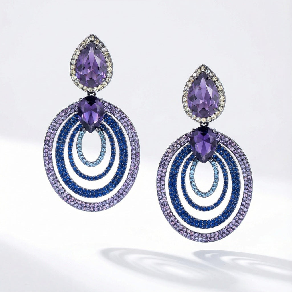 Teardrop drop earrings with purple and blue cubic zirconia stones in black metal