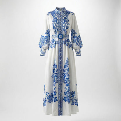 Front view of the Teresa maxi dress in white with blue porcelain floral print, featuring long lantern sleeves and a matching blue belt