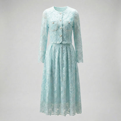 Thelma two-piece set featuring a pink floral lace cropped jacket with large pearl buttons and a matching 75cm midi skirt.