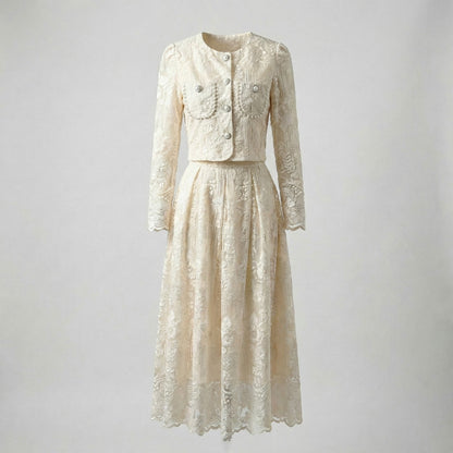 Thelma two-piece set featuring a pink floral lace cropped jacket with large pearl buttons and a matching 75cm midi skirt.