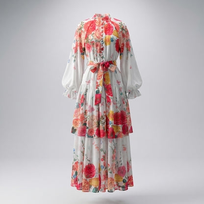 Front view of Tracy floral chiffon maxi dress in white with red rose and butterfly print, featuring tiered skirt and lantern sleeves.