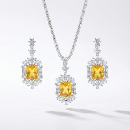 Yellow or emerald crystal drop necklace and earrings set with cubic zirconia rhinestones in silver color metal