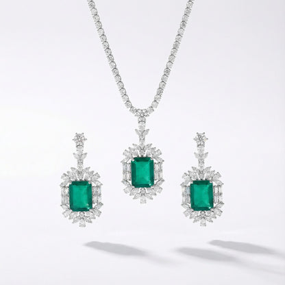 Yellow or emerald crystal drop necklace and earrings set with cubic zirconia rhinestones in silver color metal