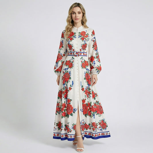 Front view of Yuliana ivory maxi dress with large red rose print, lantern sleeves, and a matching floral belt with blue trim