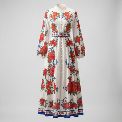 Front view of Yuliana ivory maxi dress with large red rose print, lantern sleeves, and a matching floral belt with blue trim