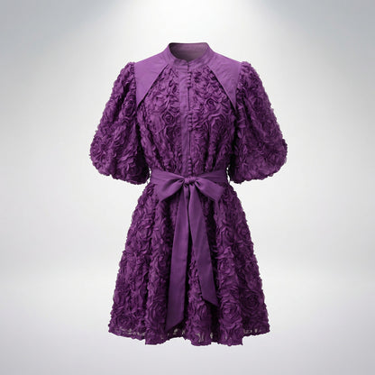Zoe 3D rosette textured mini dress with puff sleeves and waist tie, 95cm length, available in black, pink, purple, wine, and cream.
