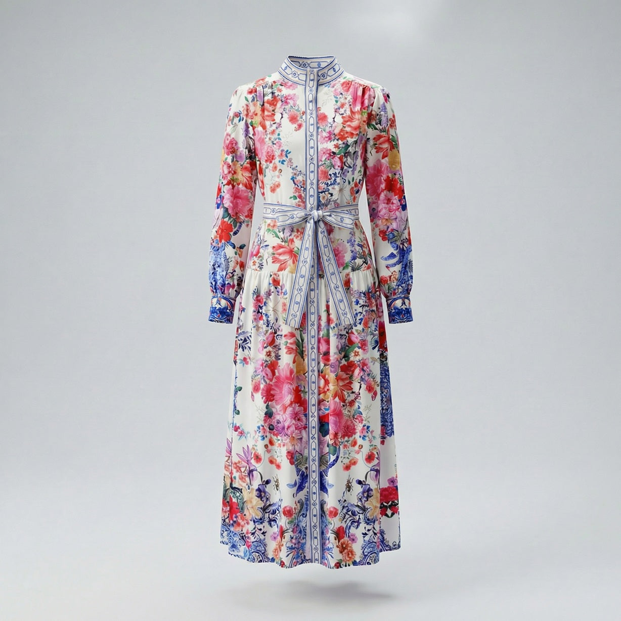 Woman wearing Zohra long sleeve maxi dress with pink floral and blue porcelain print, 130cm length.