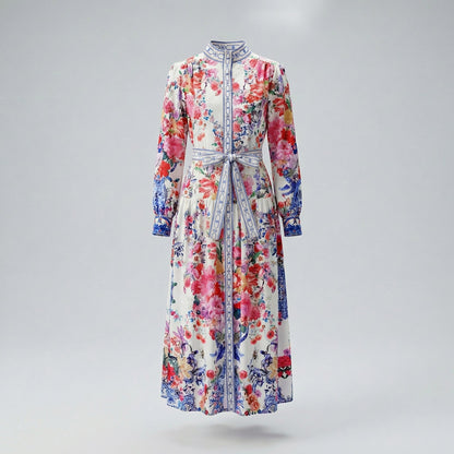 Woman wearing Zohra long sleeve maxi dress with pink floral and blue porcelain print, 130cm length.